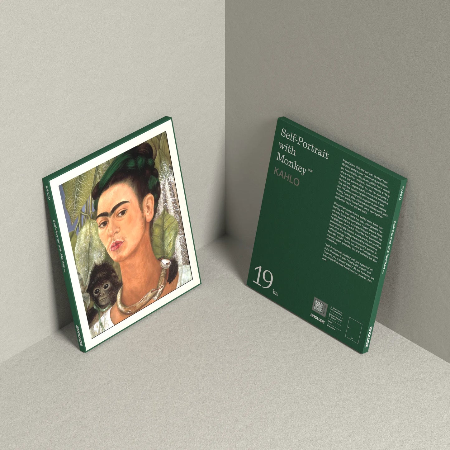 Corner setup showing front & back of Self-Portrait with Monkey art print by Frida Kahlo on display, leaning against the wall